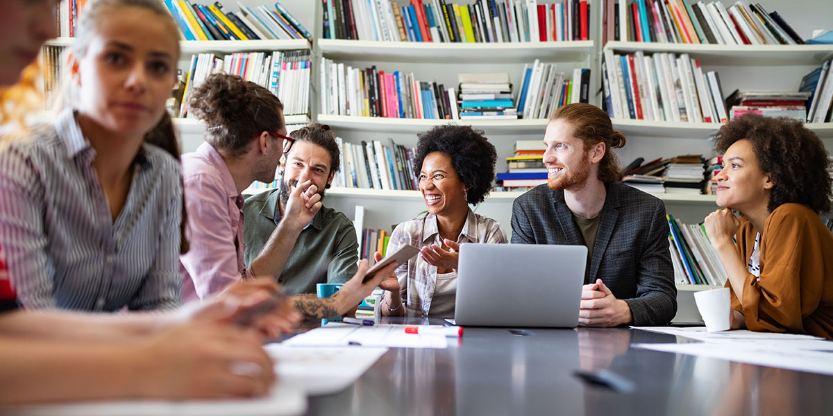 A group of designers sitting around a table ideating