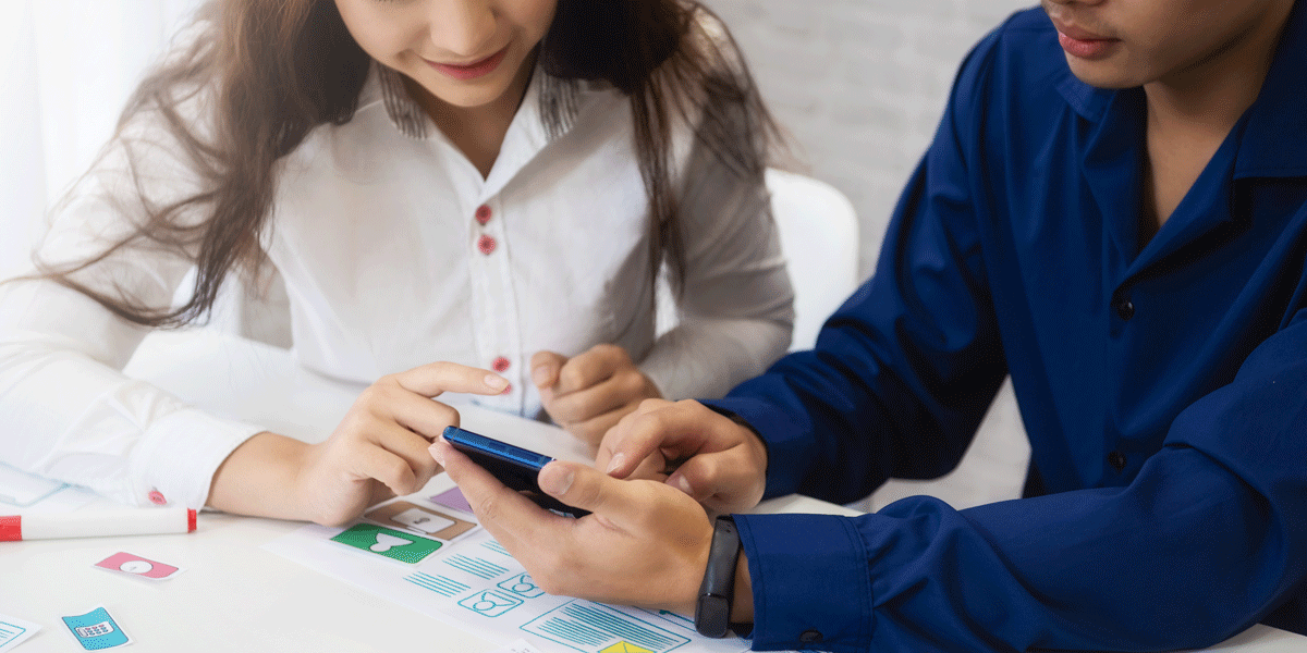 A UX designer and a user testing a prototype